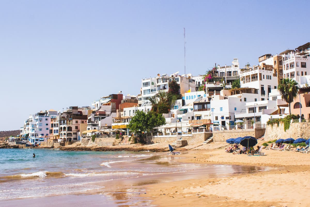 Taghazout beach with white buildings and the Atlantic coastline, Morocco